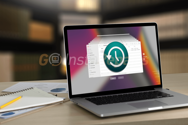 Apple macbook displaying time machine on the screen