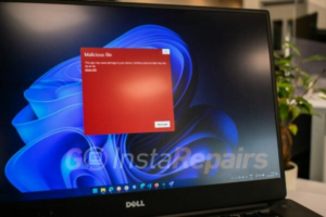 a dell laptop computer with a red screen